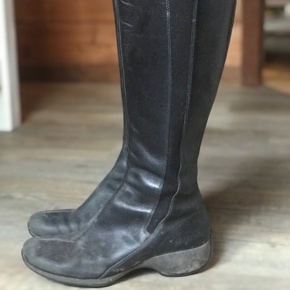 Merrell Leather rain boot. Tall,elastic and zipper
